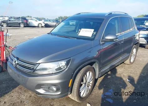 2014 Volkswagen Tiguan Sel z USA, uszkodzony, nr VIN WVGAV3AXXEW556304